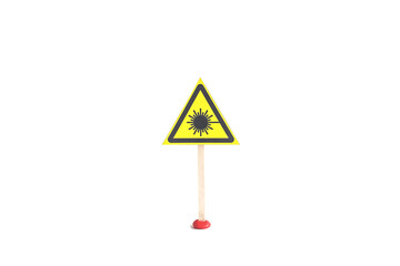 Warning sign about laser radiation yellow triangle on a white background, isolate