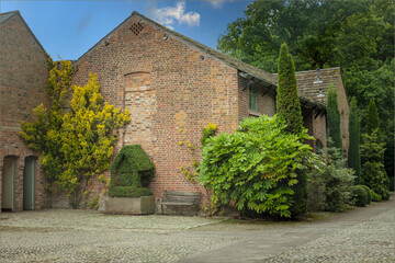 Fototapeta premium Looking across a cobbled court yard at a building