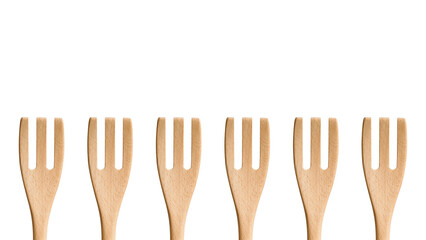 Group pattern of wooden cooking forks isolated on white copy-space background.