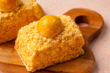 Nastar Cake is vanilla sponge based with crumbs, layered by pineapple jam and cheese cream. Topping with nastar cookies crumbs