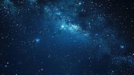 Obraz premium A vast, dark blue night sky studded with countless twinkling stars, some forming faint streaks of light