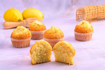Muffins on Marble with Lemons and Juicer
