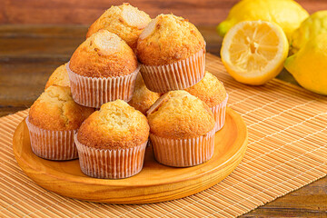 Muffins on Wooden Plate with Lemons