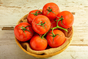 Basket of Vine Tomatoes on Light Wood