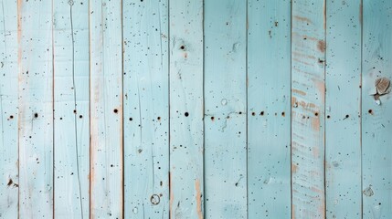 A blue wooden wall with holes in it