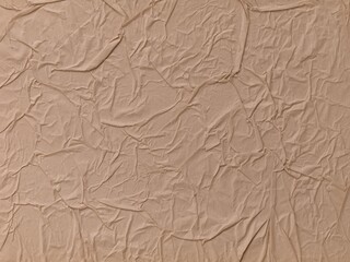 A background made of beige crumpled paper