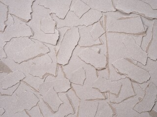 Obraz premium A background made of pieces of cardboard paper