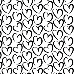 Doodle hearts seamless pattern. Black and white. Love valentine's day background .Brush illustrator.	
