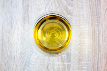 Wine glass on the table top view. A glass with a drink, alcohol.