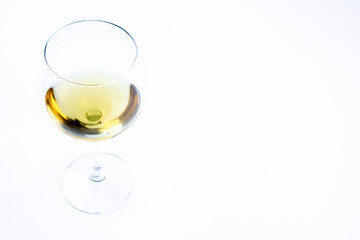 Wine glass on white background with space for copy, text. Wine, alcohol, drink in a glass.
