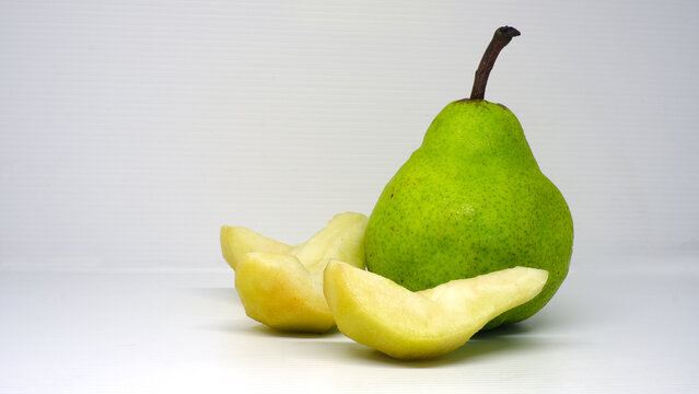 Green pear, Packham's Triumph Pear, Packham pear  with science name Pyrus communis on white background