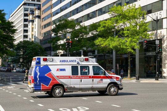Washington DC, USA - 2 May 2024: Emergency ambulance operated by AMR driving on a city street