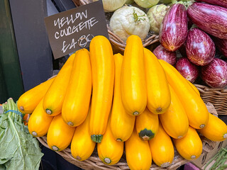 Yellow courgettes on a market stall