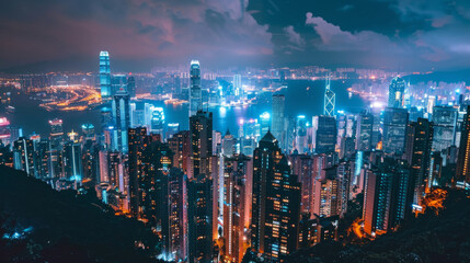 A city skyline at night with bright lights and tall buildings reaching into the sky.