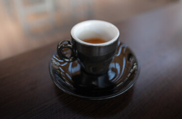 Coffee cup top view on wooden table background.