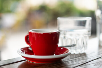 Coffee cup top view on wooden table background.