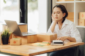 Starting Small business entrepreneur SME freelance,Portrait young woman working at home office, BOX,smartphone,laptop, online, marketing,