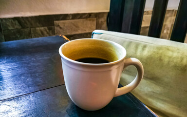 Cup of americano black coffee in restaurant cafe in Mexico.