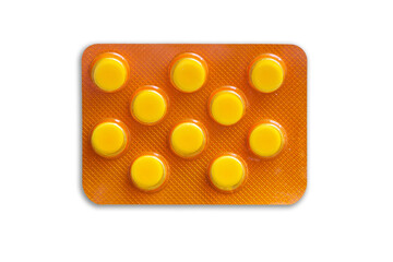 Yellow tablet blister. Golden orange pills medicine. Shiny blister with drugs isolated. Capsules in blister pack. Closeup macro medicament texture. Aluminum pills blister. Vitamin C background.