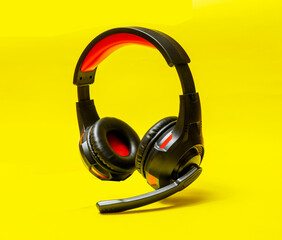 Wireless Over-Ear full size Headphones, Black leather isolated on yellow background with clipping...