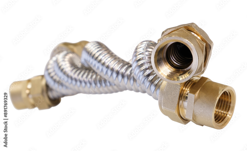 Poster corrugated stainless steel and brass flexible pipe is bent and twisted. pipe is connected to a brass