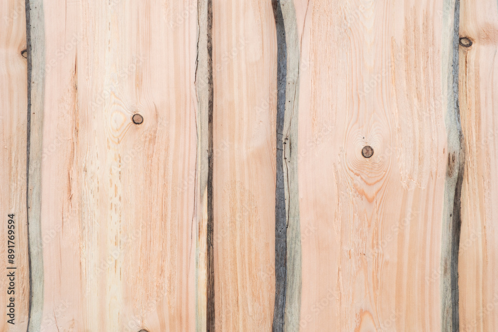 Poster a wooden surface with a grainy texture and a few holes. the wood appears to be old and weathered, gi