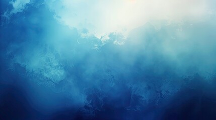 Obraz premium A hazy blue sky with white clouds and a bright light source in the background