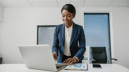 Businesswoman Working on Laptop at Office Desk