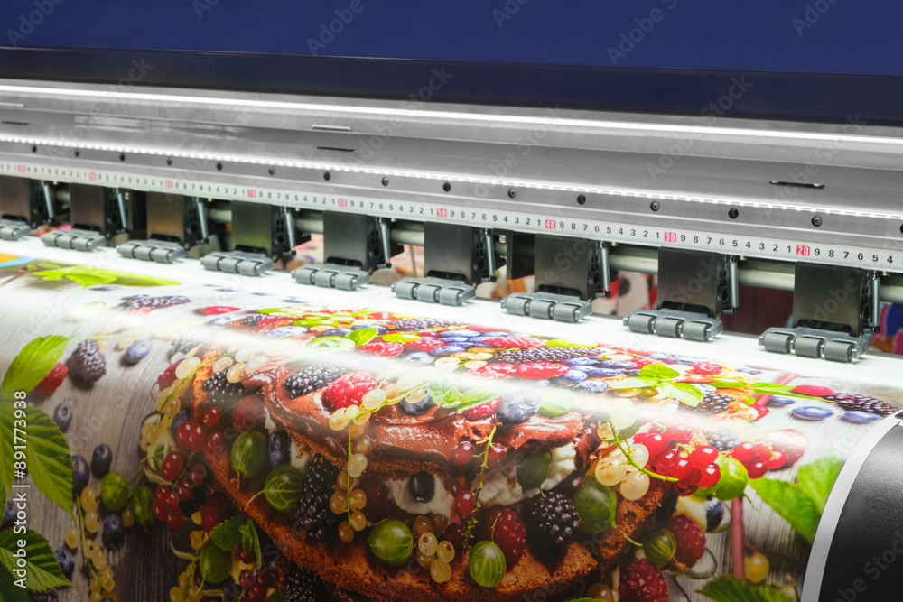 Aufkleber a large printer is printing a picture of a fruit salad. the image is colorful and vibrant, with a va