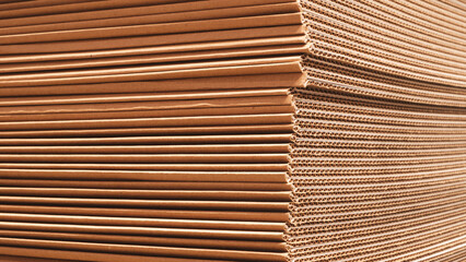 A stack of brown paper Cardboard with a wavy texture