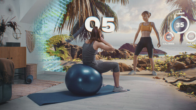 Sportswoman exercises with fitball. VR screen with displayed virtual trainer, timer and health care statistics. Online workout. Metaverse futuristic home gym with AI technologies. VFX animation.