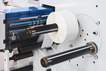 Automatic polyethylene plastic bag production machine with lighting effect. Close-up of the roller...