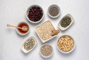 Blank photography of raw granola ingredients, almond, oat, flake, chia, seed, sesame, pumpkin,...