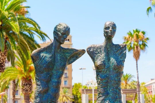 Barcelona, Spain - July 16, 2024: Close-up of the Artistic Bronze Couple Sculpture in Barcelona's Urban Landscape