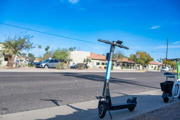 Fototapeta premium Selective focus on front wheel of a rental electric scooter in Phoenix, Arizona 