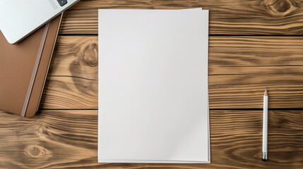 An empty blank white vertical resume paper document mockup template viewed from the top on a refined wooden office table, alongside a laptop notebook and a pencil strategically pla