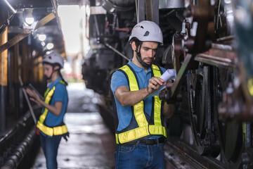 Engineer checking construction process railway and checking work on railroad station . Railway...