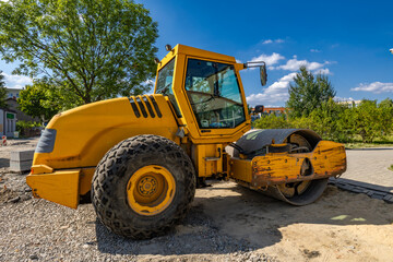Heavy construction equipment road roller while working on road construction