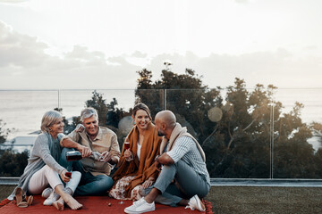 Family, champagne and celebrate outdoors at sunset for New Year, good news or announcement with mockup. Happy people, smile and drink in evening for birthday, mortgage repayment or financial security