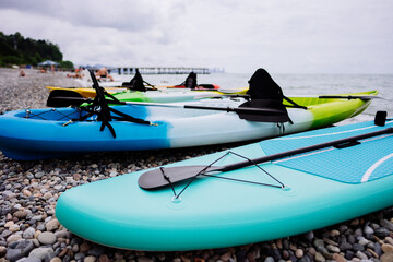 Kayaks and SUP boards on the sea. Extreme sport. Leisure. High quality photo