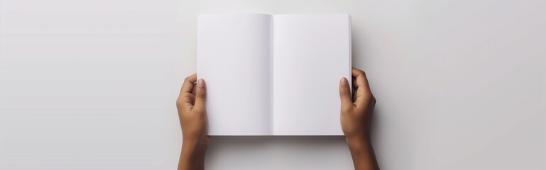 open book mockup held by hands showcasing a blank page for design isolated on a white background.
