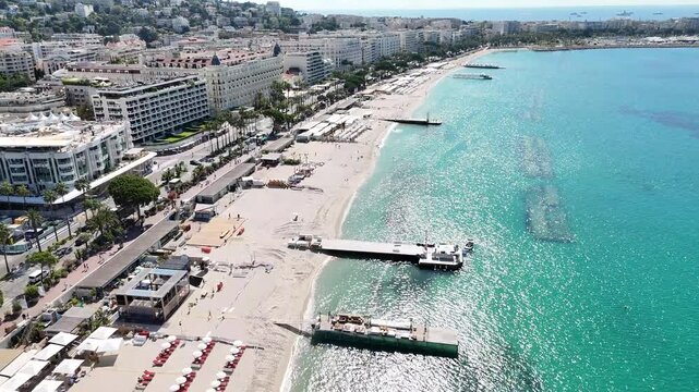 Drone shot of Cannes, France, highlighting the beautiful beaches and the stunning C&ocirc;te d'Azur coastline along the Mediterranean Sea.