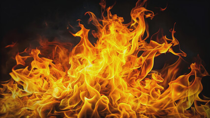 Vibrant orange and yellow flames erupt from the darkness, engulfing the black background with intense heat and light, casting flickering shadows everywhere.