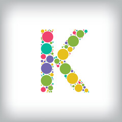 Letter K made of creative colored dots or filled with circles. Creative fonts with unique symbols. Vector illustration.
