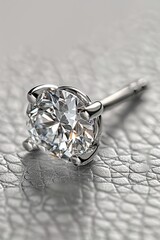 A high-resolution photograph of a single diamond stud earring, brilliant and luxurious, close-up view