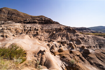 Surreal Badlands Sandstone Formations near Drumheller, Land of hoodoos, multi-hued canyons and geological erosion sculptured by water and wind