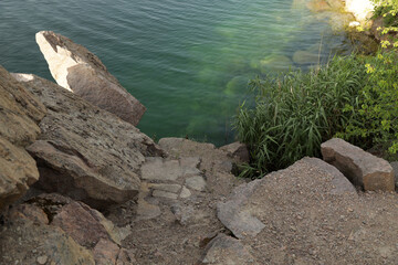 Rocky shore of a quarry lake