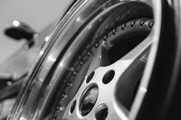 an alloy wheel, a wheel of an old racing car. Close up of vehicle details. Drivers style concept....