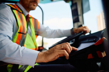 Close up of bus driver selling  ticket. © Drazen
