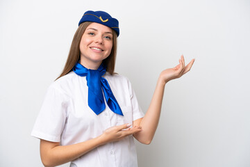 Airplane Lithuanian woman stewardess isolated on white background extending hands to the side for inviting to come